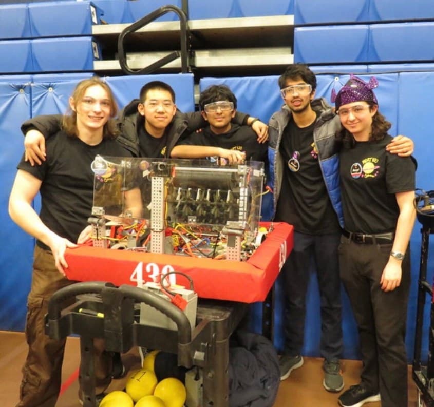 Winged Hussars founding members with the competition robot during the trial season