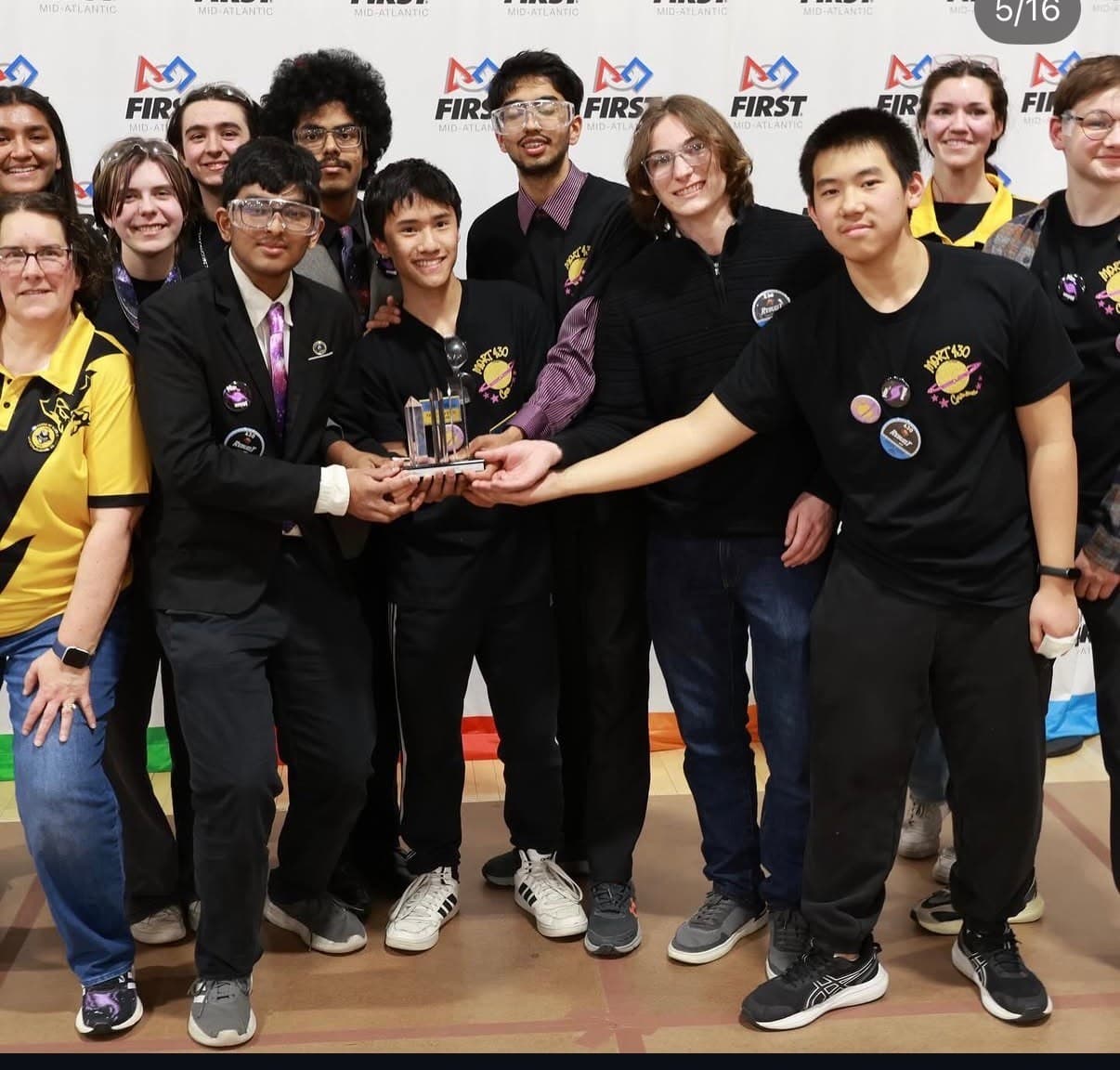 Winged Hussars founding members holding their first-place trophy